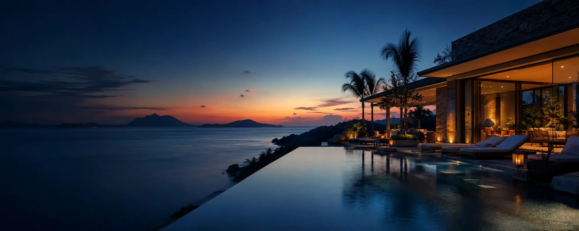 Luxury coastal resort with an infinity pool at sunset